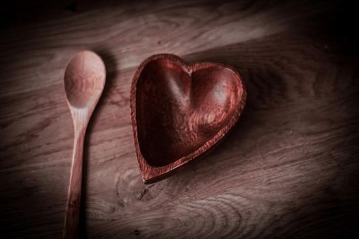 closeup. empty wooden salad bowl and wooden paddle on a wooden table