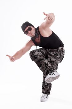 in full growth.Studio portrait of a tough rapper in sunglasses .isolated on white background.