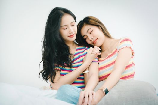 lgbtq, lgbt concept, homosexuality, portrait of two Asian women posing happy together and showing love for each other while being together.