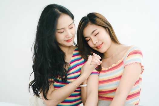 lgbtq, lgbt concept, homosexuality, portrait of two Asian women posing happy together and showing love for each other while being together.