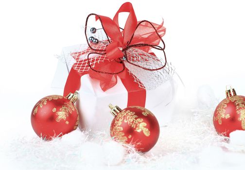 christmas gift with red balls bow