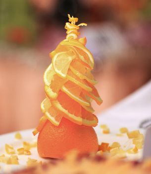 variety of delicious culinary products. Orange tree in the form of Christmas tree