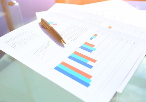 financial and business color charts and graphs on the table