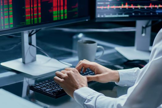 financial analyst working on a personal computer. cryptocurrency, close-up.