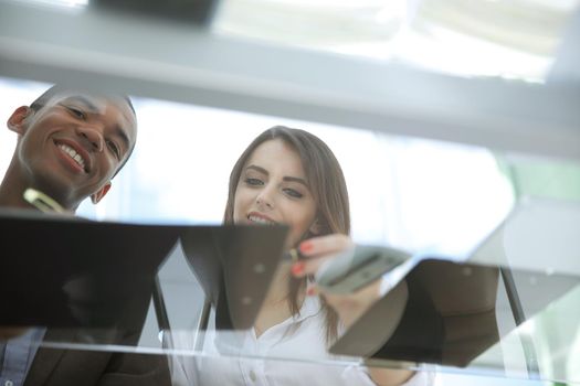 bottom view. background image business colleagues in the workplace.business background.