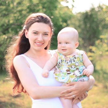 smiling mother and happy daughter on a walk in the Park.