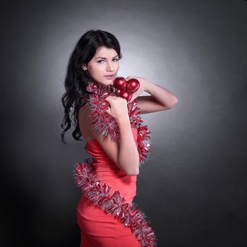 side view.beautiful young woman in a red dress. isolated on black.photo with copy space.