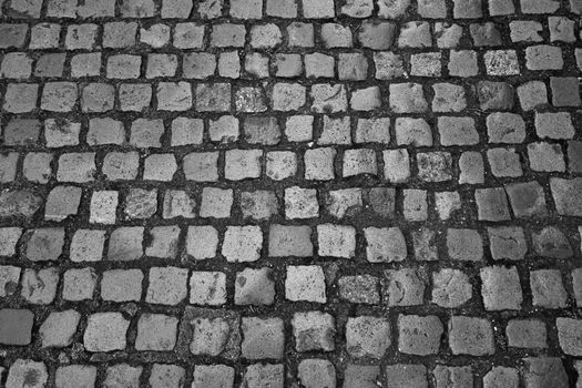 Black and white photo. View of paving slabs. Background, texture of the stone