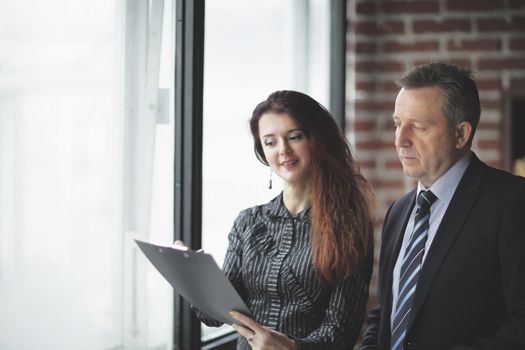 closeup.business woman and investor standing in the office.business concept