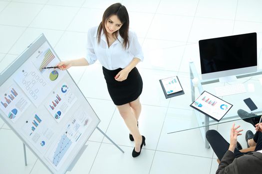 young business woman making a presentation to his business team in a modern office