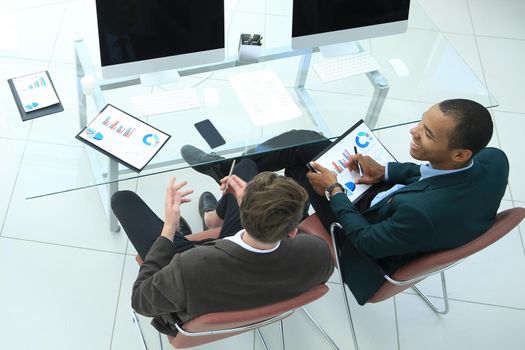 young business woman making a presentation to his business team in a modern office