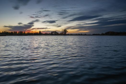 Evening sky and clouds over a calm lake, Stankow, Poland