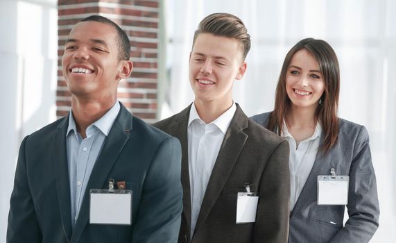representatives of successful business team with blank badges.business concept
