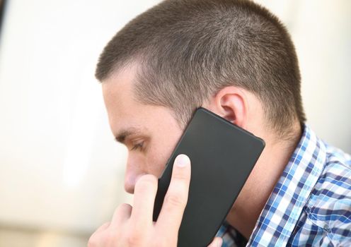 close up.a business man uses a smartphone to discuss important issues.people and technology