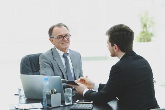 close up.business people talking at a Desk.meetings and partnership