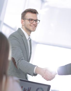 close up. handshake business partners in a modern office.photo with copy space