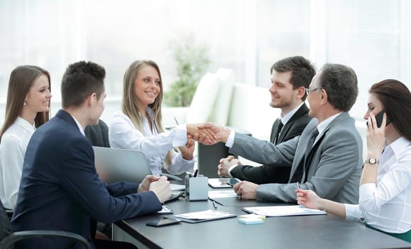 business partners shaking hands after a successful transaction.concept of partnership