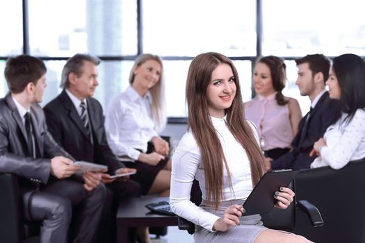 business woman assistant on the background of the working group.the concept of teamwork