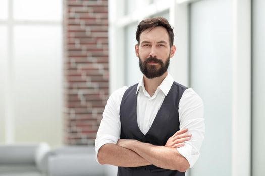 serious businessman standing in a modern office.business people