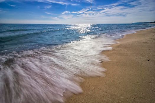 Summertime, blue sea and waves. Beautiful  low exposure water nature