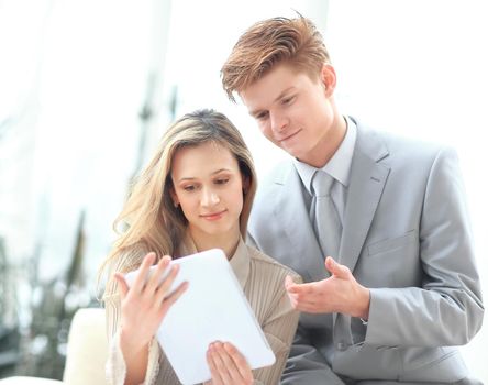 colleagues use a digital tablet to obtain the necessary information.