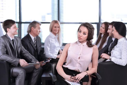 business woman assistant on the background of the working group.the concept of teamwork