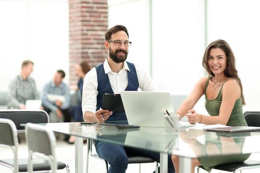 business colleagues sitting at their Desk in the office.the concept of a startup