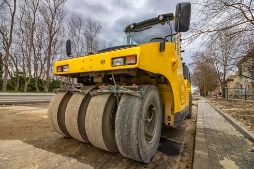 Close view on the road roller. Street paving works