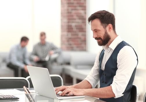 businessman working on a laptop in a modern office.people and technology