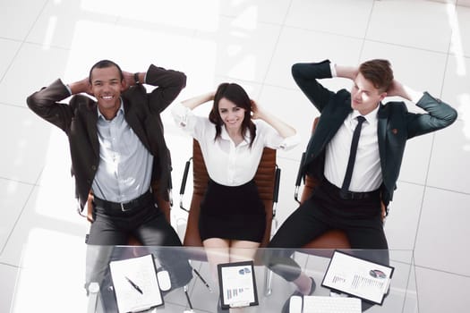 view from the top.portrait of a close-knit business team.photo with copy space.
