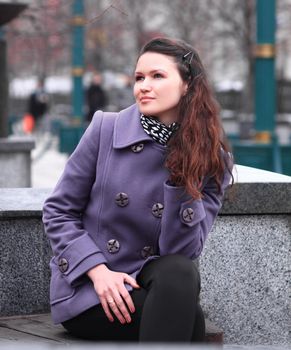 portrait of modern young woman on city background.