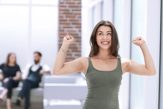 happy young lady standing in Bank office.photo with copy space