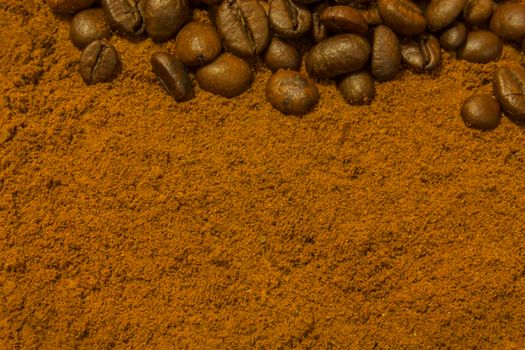 Background with coffee beans and ground coffee