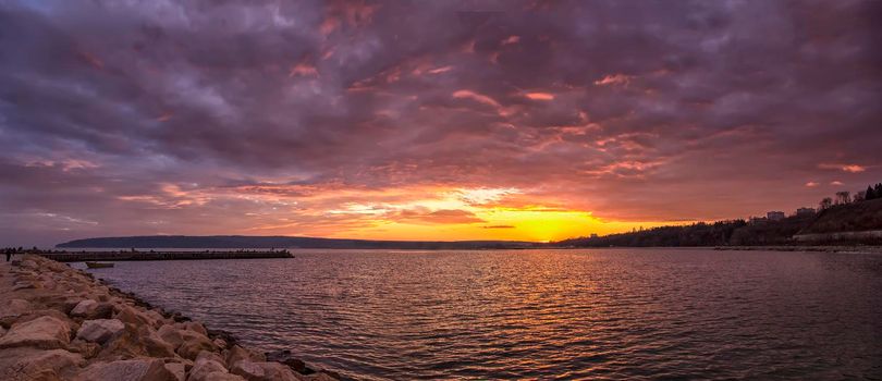 Scenic view of beautiful sunset above the horizon. Stunning sky clouds in the sunset.