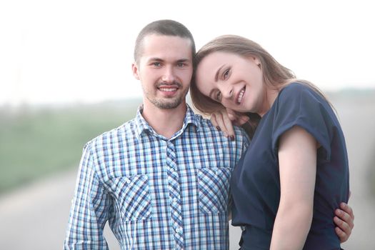 portrait of a young couple standing on the street .photo with copy space