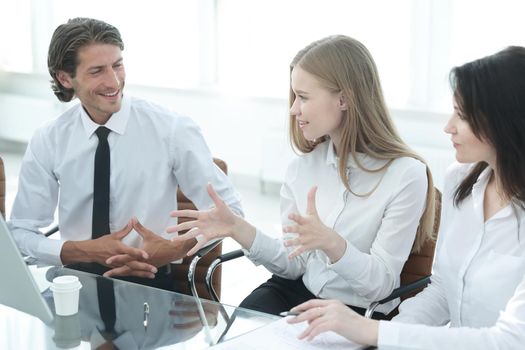 closeup.young business woman talking with colleagues.the concept of teamwork