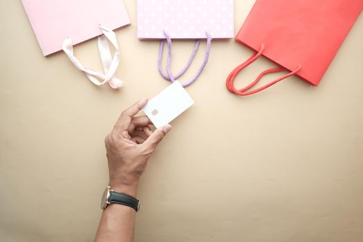 top view of person hand holding credit card.