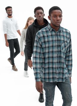 group of diverse young people striding forward. photo with a copy-space