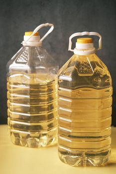 yellow sunflower oil bottle on table .