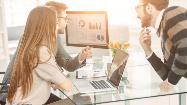 specialist in Finance and professional business team doing analysis of marketing reports, in a modern office