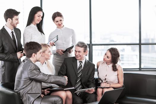 A group of businessmen discussing the policy of the company in the office.