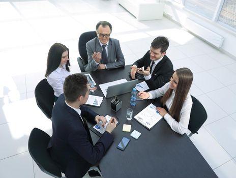 from the top view.business team discussing a problem with a business.office weekdays