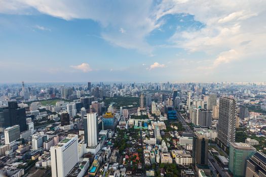 The Bangkok, Thailand - April 30, 2022: City skyline taken from the rooftop of the Mahanakorn tower on Sathorn road