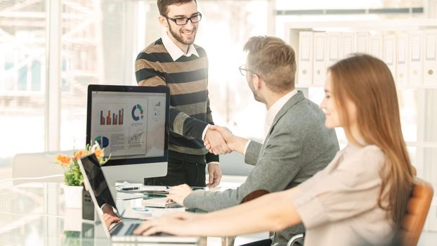 handshake of lawyers before the discussion of the financial conditions of the new contract between the new business partners.the photo has a empty space for your text.
