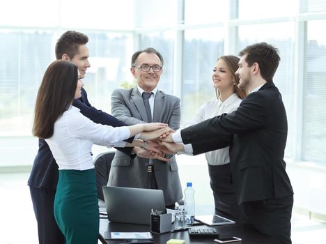 professional business team shows its unity.the concept of teamwork.photo with place for text