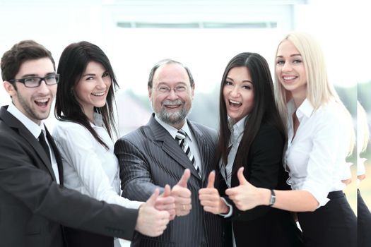 closeup head and business team showing thumb up.concept approval