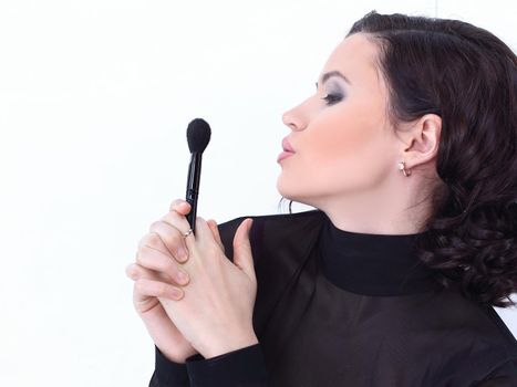 smiling young woman with brush for makeup.photo with copy space