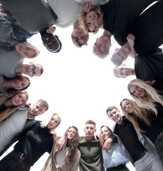 bottom view. a large group of young people standing in a circle. photo with copy space