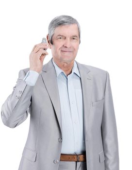 confident senior businessman with mobile phone.isolated on a white background