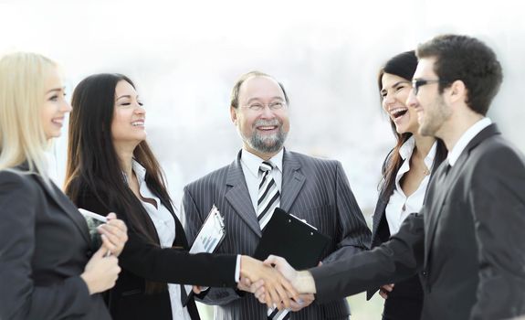 professional business team and shaking hands of young business partners in the office.photo with place for text